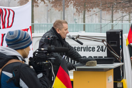 BERLIN - JANUARY 23, 2016: Russian Diaspora in Berlin protesting against migrants and refugees due to the sexual abuse of women and children.のeditorial素材