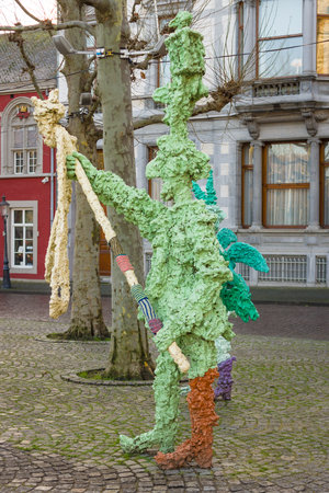 MAASTRICHT, NETHERLANDS - JANUARY 16, 2016: Vrijthof square. People and animals in stone and bronze by Han van Wetering. Sculpture dedicated to the carnival.のeditorial素材