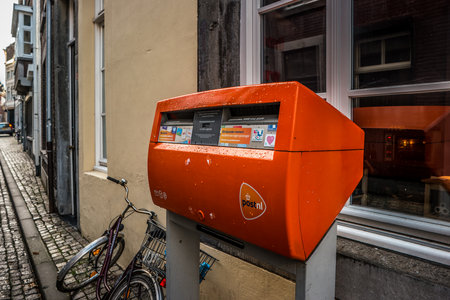 MAASTRICHT, NETHERLANDS - JANUARY 16, 2016: Orange mailbox postal service of the Netherlands.のeditorial素材