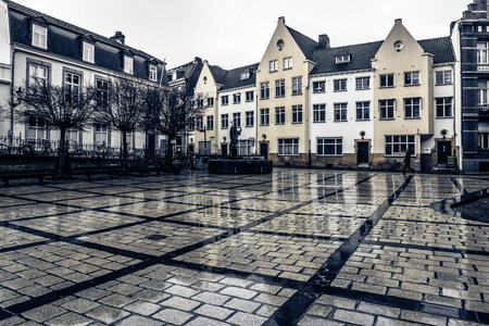 MAASTRICHT, NETHERLANDS - JANUARY 16, 2016: One of the squares of the city after the rain. Black and white. Toning. Maastricht is the oldest city of the Netherlands and the capital city of the province of Limburg.のeditorial素材