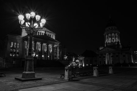 BERLIN - MARCH 05, 2016: Square Gendarmenmarkt, Konzerthaus and French Cathedral in night illumination. Black and white.のeditorial素材