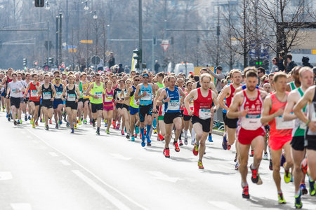 BERLIN - APRIL 03, 2016: The annual Berlin Half Marathon. Race through the city streets.のeditorial素材