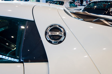 STUTTGART, GERMANY - MARCH 17, 2016: Fragment of a mid-engined plug-in hybrid sports car Porsche 918 Spyder, 2015. The cover of the fuel tank. Europe's greatest classic car exhibition "RETRO CLASSICS"のeditorial素材