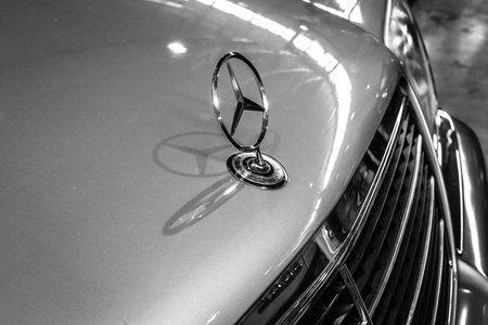 STUTTGART, GERMANY - MARCH 18, 2016: Hood ornament of Mercedes-Benz 300 SE (W140), close-up. Black...