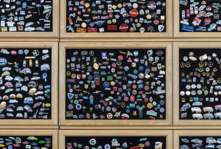 STUTTGART, GERMANY - MARCH 18, 2016: Background of lapel pins with the logos of well-known automobile firms (modern and retro). Europe's greatest classic car exhibition "RETRO CLASSICS"のeditorial素材