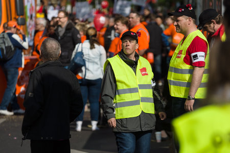 BERLIN - MAY 01, 2016: Members of the security services. Members of trade unions, workers and employees at the demonstration on the occasion of Labour day.のeditorial素材