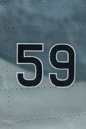 Figure 59 applied to a metal surface with rivets.