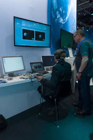BERLIN, GERMANY - JUNE 01, 2016: The stand of German Aerospace Center (DLR). The simulator remote...