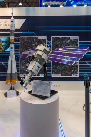 BERLIN, GERMANY - JUNE 01, 2016: The stand of State Space Corporation - Roscosmos (Russia). Model of satellite Resurs-P. Exhibition ILA Berlin Air Show 2016.のeditorial素材