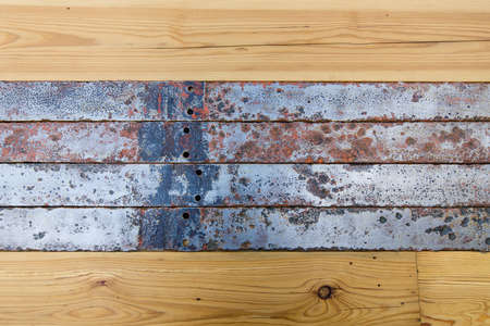 Old wooden boards and metal tape.