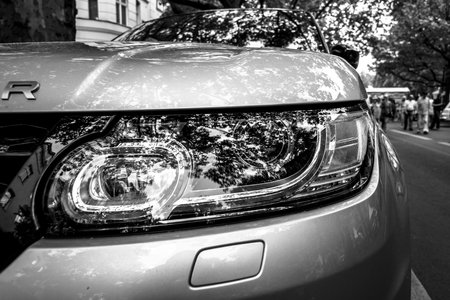 BERLIN - JUNE 05, 2016: Headlamp of mid-size luxury SUV Range Rover Sport, since 2013. Black and white. Classic Days Berlin 2016.のeditorial素材