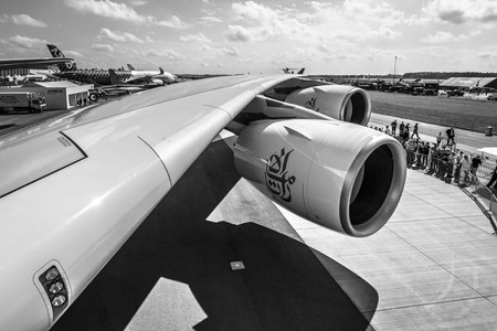 BERLIN, GERMANY - JUNE 01, 2016: Detail of the wing and a turbofan engine "Engine Alliance GP7000" of the largest aircraft in the world - Airbus A380. Emirates Airline. Black and white. Exhibition ILA Berlin Air Show 2016のeditorial素材