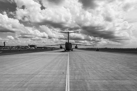 BERLIN, GERMANY - JUNE 02, 2016: Military transport aircraft Antonov An-178 on the taxiway. Waiting takeoff. Black and white. Exhibition ILA Berlin Air Show 2016のeditorial素材