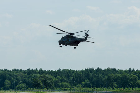 BERLIN, GERMANY - JUNE 03, 2016: Helicopter NH90 of the German Army. Demonstrative performance. Exhibition ILA Berlin Air Show 2016のeditorial素材