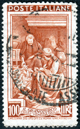 ITALY - CIRCA 1950: Postage stamp printed in Italy, shows the harvest of maize in the region Friuli-Venezia Giulia, circa 1950のeditorial素材