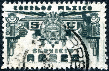 MEXICO - CIRCA 1934: Postage stamp printed in Mexico, shows God of Aztec mythology, Mictlantecuhtli, circa 1934のeditorial素材