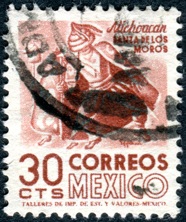 MEXICO - CIRCA 1950: Postage stamp printed in Mexico, shows Indian dancer, Michoacan, circa 1950のeditorial素材