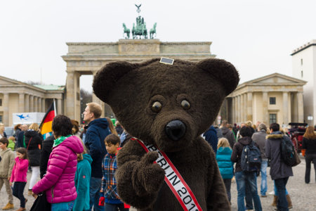 BERLIN, GERMANY - NOVEMBER 01, 2013: The Bear - a symbol of Berlin on the background of the Brandenburg Gate.のeditorial素材
