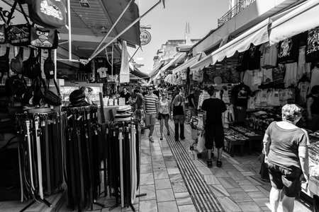 HERAKLION, GREECE - JULY 09, 2016: Crete. The popular market and shopping street â1866 in the historic center of the city. Black and white. Heraklion - the largest city on the island.のeditorial素材