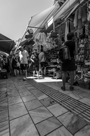 HERAKLION, GREECE - JULY 09, 2016: Crete. The popular market and shopping street â1866 in the historic center of the city. Black and white. Heraklion - the largest city on the island.のeditorial素材