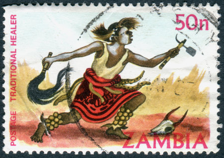 ZAMBIA - CIRCA 1981: A stamp printed in Zambia, is dedicated to Cultural Heritage, shows a Traditional healer, circa 1981のeditorial素材