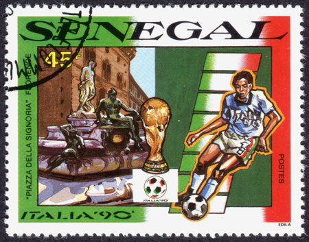 SENEGAL - CIRCA 1990: A stamp printed in Senegal, devoted World Cup Italy 90, shows Piazza della Signoria, Florence, and football player, circa 1990のeditorial素材