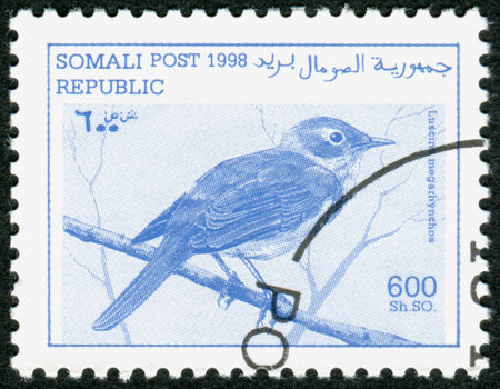 SOMALIA - CIRCA 1998: A stamp printed in Somalia, shows bird Common nightingale (Luscinia megarhynchos), circa 1998のeditorial素材