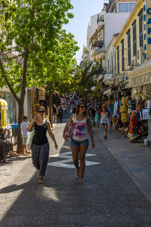 CRETE, GREECE - JULY 11, 2016: The narrow shopping streets of a coastal elite tourist town Agios Nikolaos on the Greek island of Crete.のeditorial素材