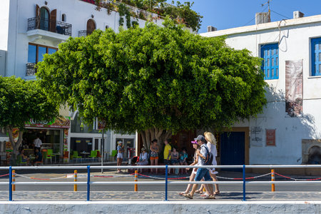 CRETE, GREECE - JULY 11, 2016: The narrow shopping streets of a coastal elite tourist town Agios Nikolaos on the Greek island of Crete.のeditorial素材