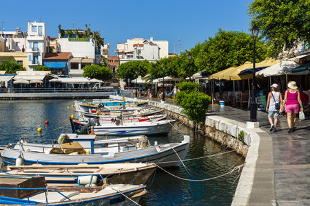 CRETE, GREECE - JULY 11, 2016: The embankment of a coastal elite tourist town on the Greek island of Crete - Agios Nikolaos.のeditorial素材