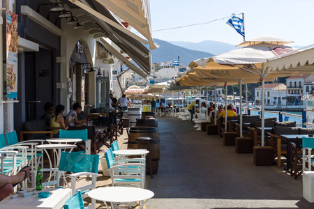 CRETE, GREECE - JULY 11, 2016: Cafes on the embankment of a coastal elite tourist town Agios Nikolaos on the Greek island of Crete.のeditorial素材
