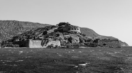 Gulf of Elounda. The island of Spinalonga and the ancient fortress of the same name. Black and white. Crete. Greece.のeditorial素材