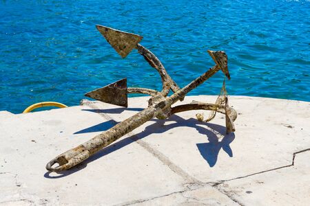 Old anchor on the berth.の写真素材