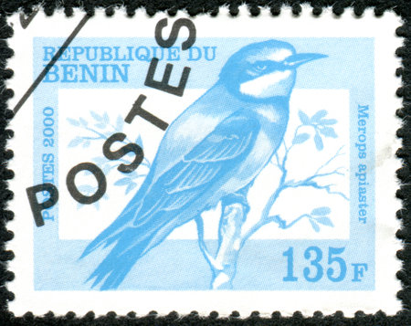 BENIN - CIRCA 2000: A stamp printed in Benin, shows a bird European Bee-eater (Merops apiaster), circa 2000のeditorial素材