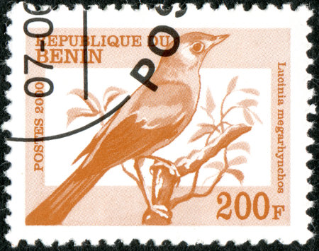 BENIN - CIRCA 2000: A stamp printed in Benin, shows a bird Common Nightingale (Lucinia megarhynchos), circa 2000のeditorial素材
