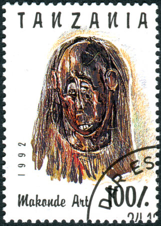 TANZANIA - CIRCA 1992: A stamp printed in Tanzania dedicated to Makonde Art, shows the Female Head, circa 1992のeditorial素材