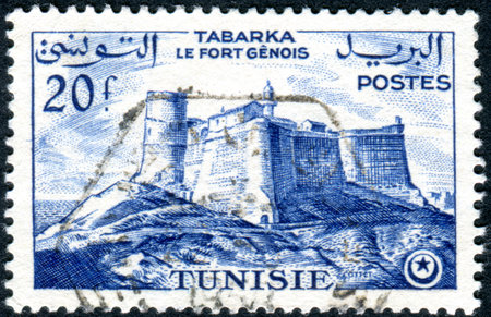 TUNISIA - CIRCA 1954: A stamp printed in Tunisia, shows the Genoese fortress in Tabarka, circa 1954のeditorial素材