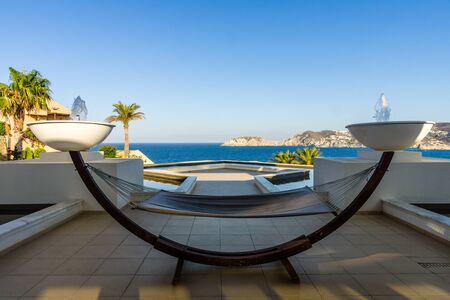 Sea view from the Mononaftis village. In the foreground, a hammock for relaxing. Crete. Greece.の写真素材