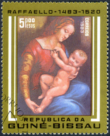 GUINEA - BISSAU - CIRCA 1983: A stamp printed in Guinea-Bissau, shows a painting Orleans Madonna by Raphael, a collection of Musee Conde, Chantilly, circa 1983のeditorial素材
