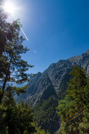 Samaria Gorge. Crete. Greece. Lens flare on the blue sky.