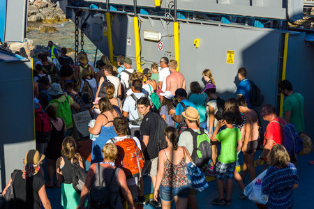 CRETE, GREECE - JULY 14, 2016: Ferry at the pier. Out of passengers from the ferry. The small village of Chora Sfakion, Chania region of Crete.のeditorial素材