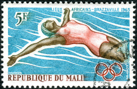 MALI - CIRCA 1965: A stamp printed in Mali, shows a Cattle Herd (Bos primigenius taurus), circa 1965のeditorial素材