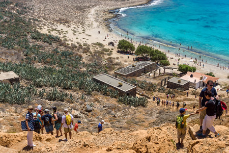 CRETE, GREECE - JULY 18, 2016: The descent of tourists from the ancient Venetian fortress. The island Imeri Gramvousa. Mediterranean Sea.のeditorial素材