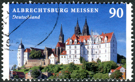 GERMANY - CIRCA 2014: A stamp printed in Germany, shows the Albrechtsburg and Meissen Cathedral, circa 2014のeditorial素材