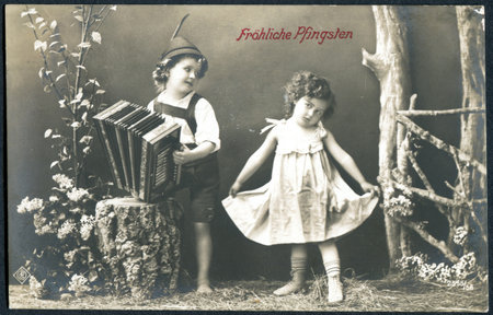 GERMANY - CIRCA 1914: A postcard printed in Germany, shows a boy and a girl. The inscription in...