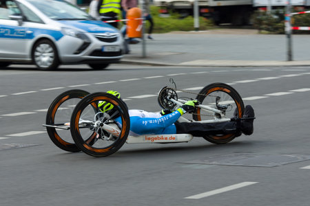 BERLIN - APRIL 02, 2017: The annual 37th Berlin Half Marathon. Wheelchair competitors & hand...