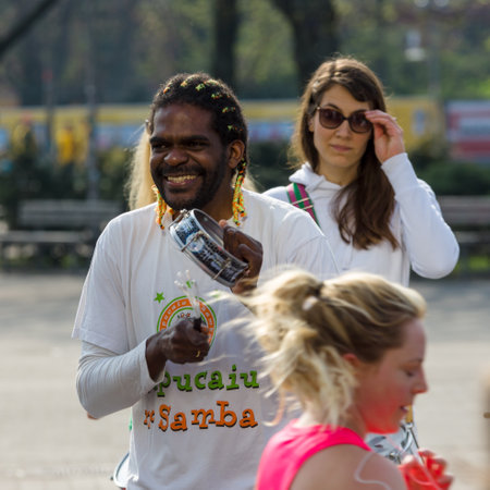 BERLIN - APRIL 02, 2017: The annual 37th Berlin Half Marathon. Athletes are running. Fans play the...