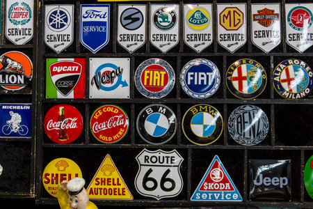STUTTGART, GERMANY - MARCH 03, 2017: Souvenir magnets with logos of famous automotive brands, oil companies and beverage producers. Europe's greatest classic car exhibition "RETRO CLASSICS"のeditorial素材