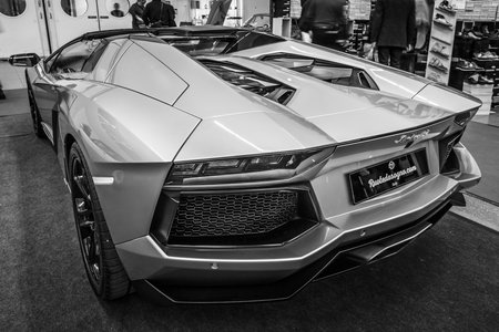 STUTTGART, GERMANY - MARCH 03, 2017: Sports car Lamborghini Aventador LP 700-4, 2014. Rear view. Black and white. Europe's greatest classic car exhibition "RETRO CLASSICS"のeditorial素材