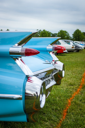 PAAREN IM GLIEN, GERMANY - JUNE 03, 2017: Rear stoplights of a full-size luxury car Cadillac Coupe DeVille, 1959 (focus in the background) Exhibition "Die Oldtimer Show".のeditorial素材